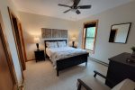 Walk-Out Basement: Bedroom w/ Queen Bed - Ensuite w/ Walk-in Shower